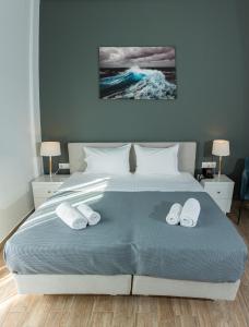 Postel nebo postele na pokoji v ubytování Blue Sea Hotel