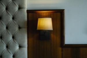 a lamp is on in a dimly lit room at Hotel Panoramic in Giardini Naxos
