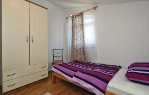 Postel nebo postele na pokoji v ubytování Apartments Vesna