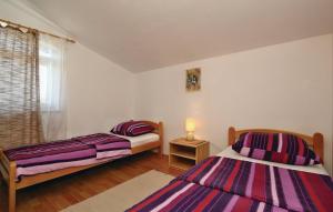 Postel nebo postele na pokoji v ubytování Apartments Vesna