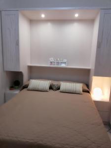 Postel nebo postele na pokoji v ubytování Casa Marcella San Vito Lo Capo