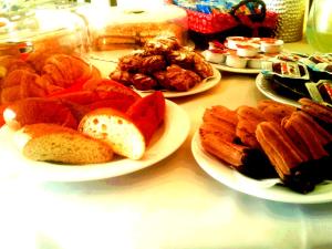 a table with plates of different types of food at Bed & Breakfast La Villetta in Botricello +24 photos