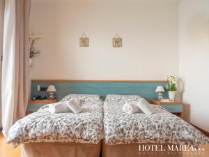 Posteľ alebo postele v izbe v ubytovaní Hotel Marea
