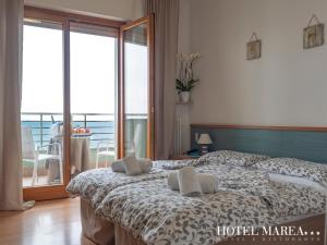 Posteľ alebo postele v izbe v ubytovaní Hotel Marea