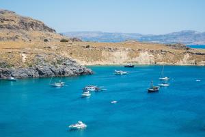a group of boats in a large body of water at Lindian Ethos in Lindos