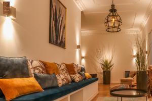 a living room with a couch and a table at Villa Zawaia B&B in Lagos
