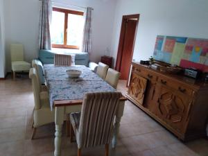 a dining room with a table and chairs at Casa Umbria in Gubbio