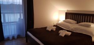 A bed or beds in a room at Duna Dráva Vendégház