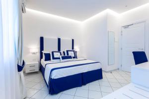 Postel nebo postele na pokoji v ubytování Hotel Bristol