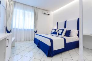 Postel nebo postele na pokoji v ubytování Hotel Bristol