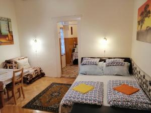 Postel nebo postele na pokoji v ubytování Garibaldi 5 Apartments & Rooms