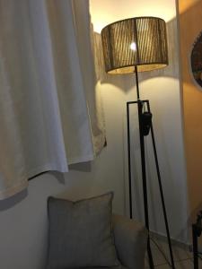 a lamp on a lamp post in a room at Argonaftes in Firostefani