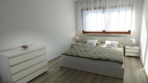 Posteľ alebo postele v izbe v ubytovaní Apartament Reda
