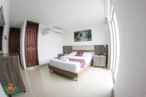 Postel nebo postele na pokoji v ubytování Hotel La Roca San Rafael
