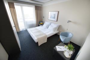 Posteľ alebo postele v izbe v ubytovaní Retro Hotel Kladno