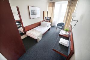 Posteľ alebo postele v izbe v ubytovaní Retro Hotel Kladno