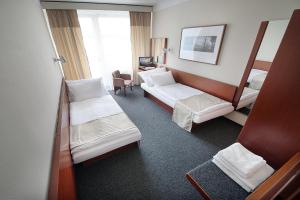 Posteľ alebo postele v izbe v ubytovaní Retro Hotel Kladno