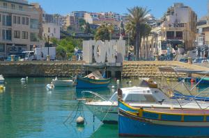 a group of boats in the water in a harbor at Couple's Getaway in Is-Swieqi