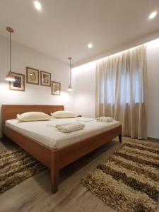 Ένα ή περισσότερα κρεβάτια σε δωμάτιο στο Apartments Tonkita with jacuzzi