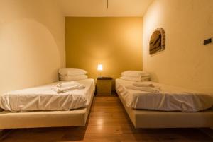 Postel nebo postele na pokoji v ubytování Hotel Leopold