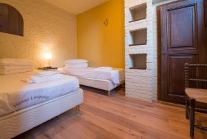 Postel nebo postele na pokoji v ubytování Hotel Leopold