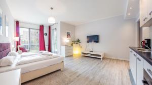 Televízia a/alebo spoločenská miestnosť v ubytovaní Sopot Residence - Sea Deluxe apartment A