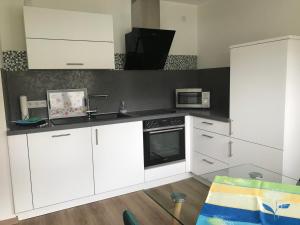 Η κουζίνα ή μικρή κουζίνα στο Ferienwohnung Am Haarhaus