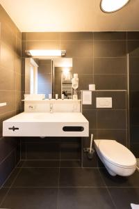 Koupelna v ubytování Hotel Leopold