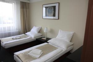 Posteľ alebo postele v izbe v ubytovaní Retro Hotel Kladno
