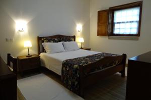 Ein Bett oder Betten in einem Zimmer der Unterkunft Quinta Vale do Homem