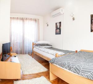 Krevet ili kreveti u jedinici u okviru objekta Hana Superior Apartments