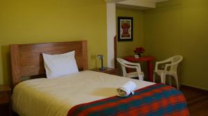 Llit o llits en una habitació de Eco Aventura Hostel Cusco