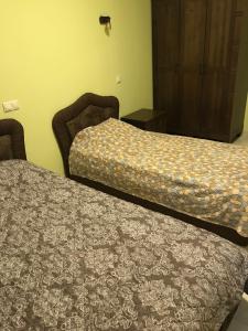Un pat sau paturi într-o cameră la Nikea Park 2022