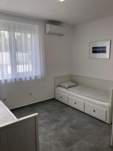 Voodi või voodid majutusasutuse Rezeda Apartman toas