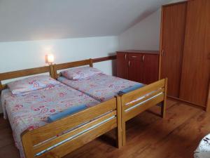 Postel nebo postele na pokoji v ubytování APARTMAN Nikolina