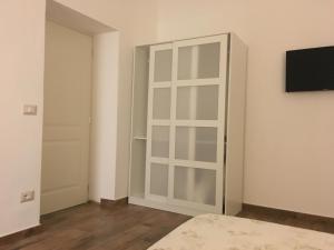 TV a/nebo společenská místnost v ubytování L’Acerba B&B