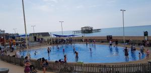 a group of people in a swimming pool at the beach at Andorra Guest Accommodation in Brighton & Hove