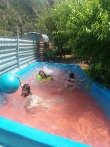 three children playing in a swimming pool at NEW SANAHIN in Alaverdi