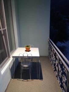 a small table and a chair in a room with a window at NEW SANAHIN in Alaverdi
