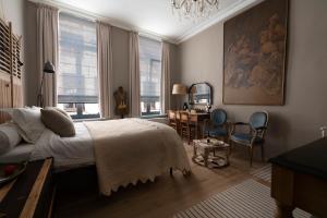 Giường trong phòng chung tại B&B Le flaneur