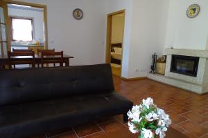 Ein Sitzbereich in der Unterkunft Quinta Vale do Homem