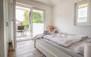 Posteľ alebo postele v izbe v ubytovaní Luxuriöse Penthaus Wohnung + 17 fotografií