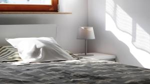 Posteľ alebo postele v izbe v ubytovaní Apartament Reda