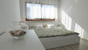 Posteľ alebo postele v izbe v ubytovaní Apartament Reda