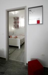 Postel nebo postele na pokoji v ubytování Apartment Kala