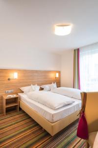 Postel nebo postele na pokoji v ubytování Hotel Haus Appel