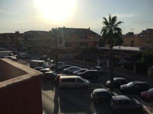 a group of cars parked in a parking lot at B&B Le Meduse in Fiumicino