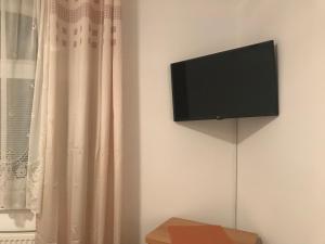 A television and/or entertainment centre at PENSION EUROP**