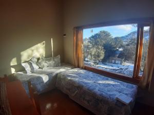 Voodi või voodid majutusasutuse Lago Mistico toas