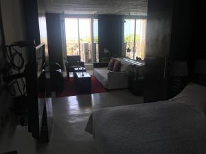 Apartamento Con Vista Al Caribe tesisinde bir odada yatak veya yataklar